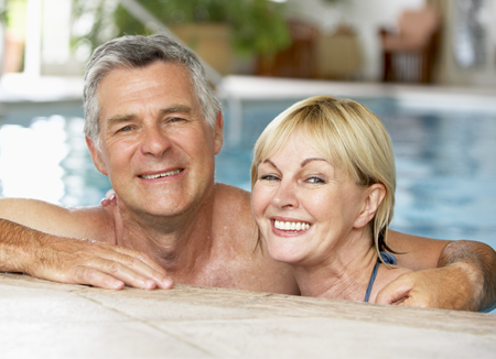 Happy Older Couple in a Pool with White Teeth in Raleigh, NC 
